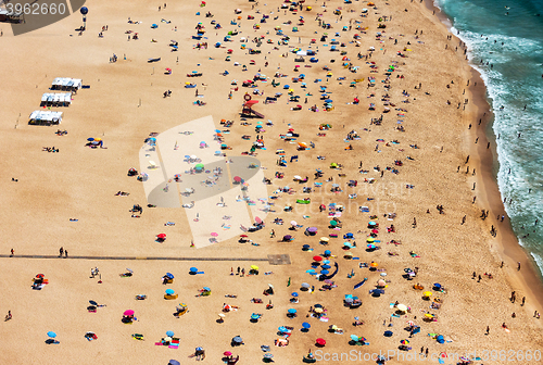 Image of Beach from Above with Many Umbrellas and People