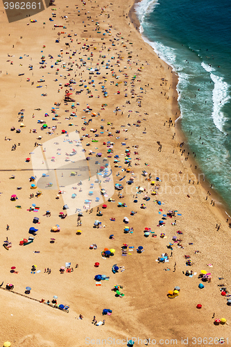 Image of Beach from Above with Many Umbrellas and People