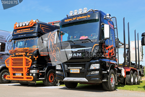 Image of New MAN and Scania Logging Trucks on a Show