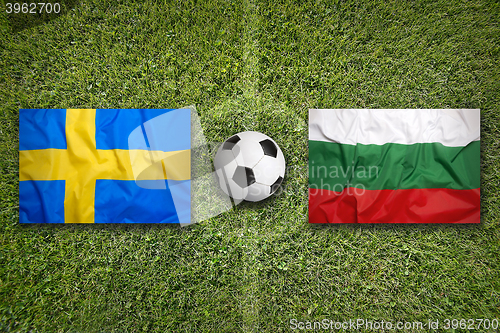 Image of Sweden vs. Bulgaria flags on soccer field