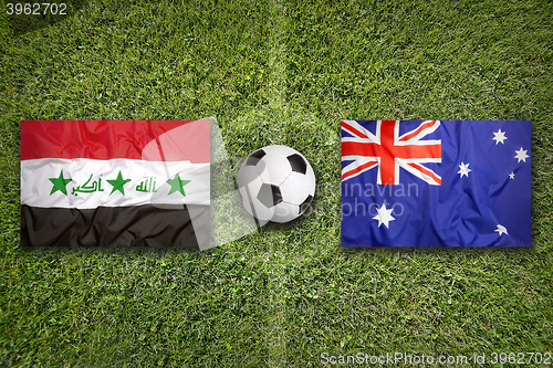 Image of Iraq vs. Australia flags on soccer field