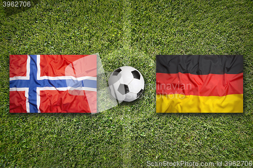 Image of Norway vs. Germany flags on soccer field