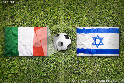 Image of Italy vs. Israel flags on soccer field