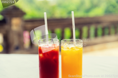 Image of glasses of fresh fruit juice at restaurant