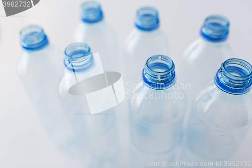 Image of close up of empty used plastic bottles on table