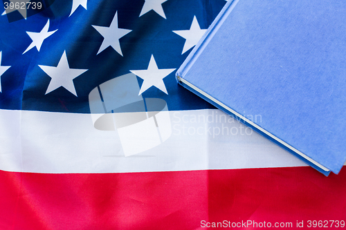 Image of close up of american flag and book