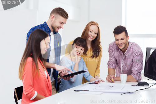 Image of happy creative team or students working at office