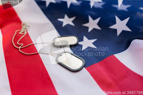 Image of close up of american flag and military badges