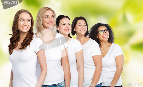 Image of group of happy different women in white t-shirts