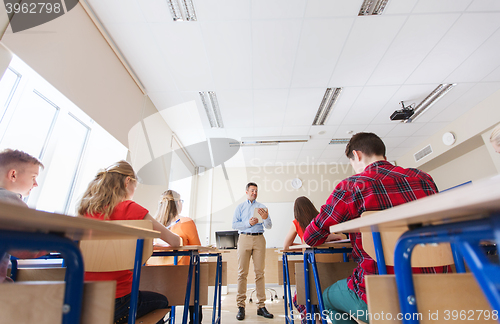 Image of students and teacher with tablet pc at school