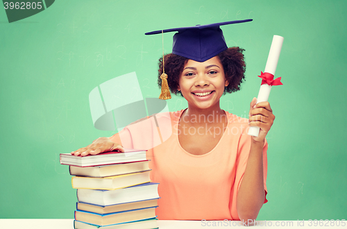 Image of happy african bachelor girl with books and diploma