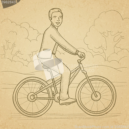 Image of Man riding bicycle.