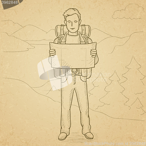 Image of Backpacker looking at map.