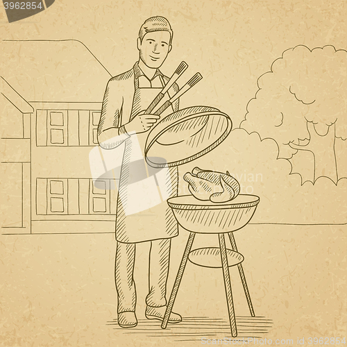 Image of Man preparing barbecue.