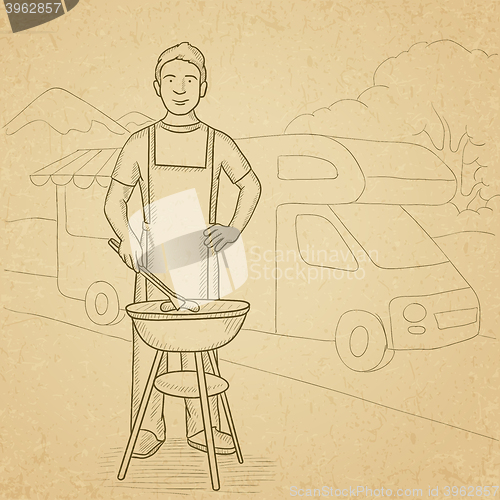 Image of Man preparing barbecue.