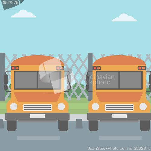 Image of Yellow buses on the background of mesh fence.