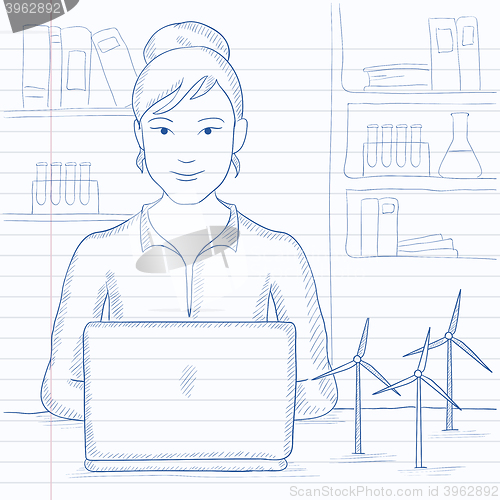 Image of Woman working at laptop. 