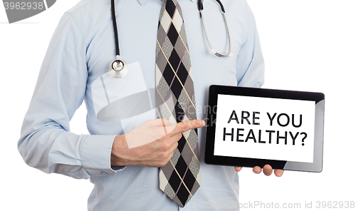 Image of Doctor holding tablet - Are you healthy?