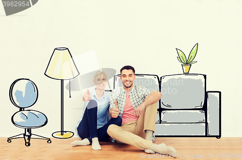 Image of happy couple showing thumbs up at new home