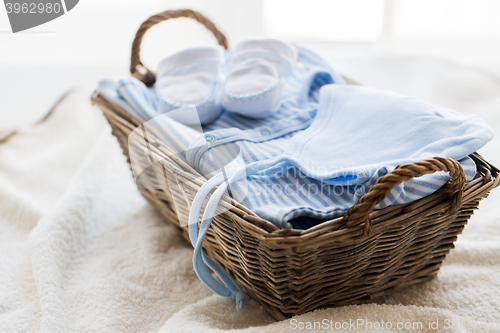 Image of close up of baby clothes for newborn boy in basket