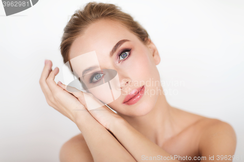 Image of beautiful young woman face and hands