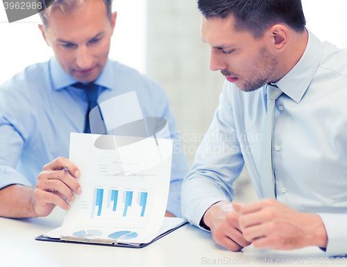 Image of businessmen with notebook on meeting