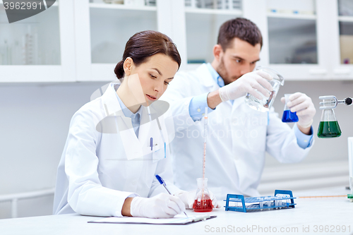 Image of young scientists making test or research in lab