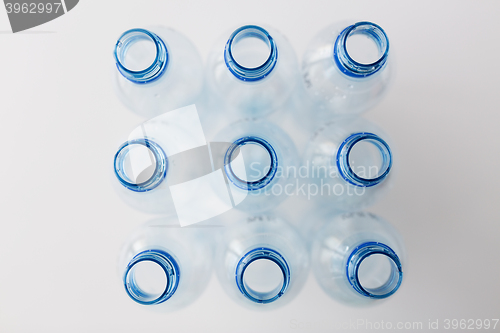 Image of close up of empty used plastic bottles on table