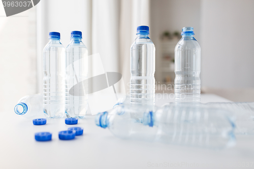 Image of close up of bottles with drinking water on table