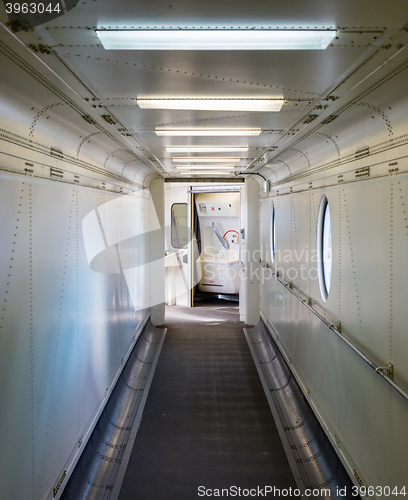 Image of Jetway, walking towards the plane, selective focus