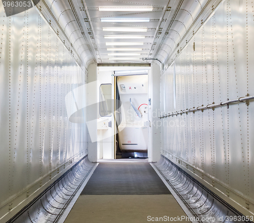 Image of Jetway, walking towards the plane, selective focus