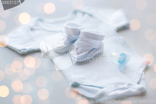 Image of close up of baby boys clothes for newborn on table