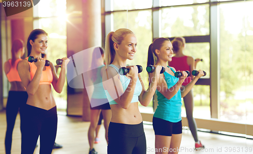 Image of group of women with dumbbells in gym