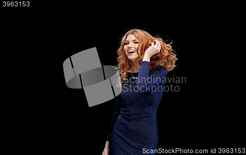 Image of happy young woman dancing at night club disco