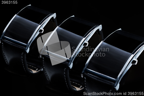 Image of close up of black smart watch or wristwatch set