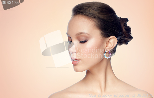 Image of close up of beautiful woman face with earring