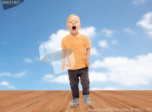 Image of happy little boy shouting or sneezing