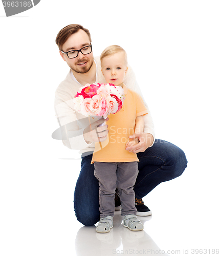 Image of happy father and son with bunch of flowers