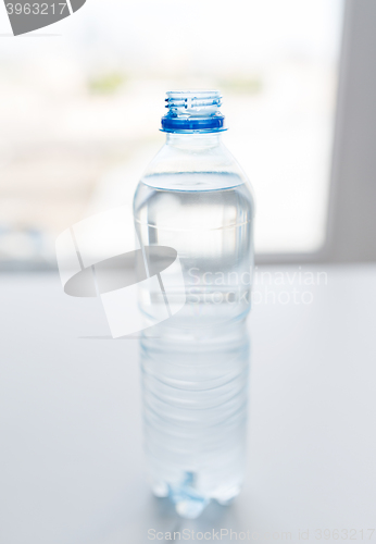 Image of close up of bottle with drinking water on table