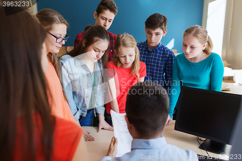 Image of group of students and teacher with tests at school