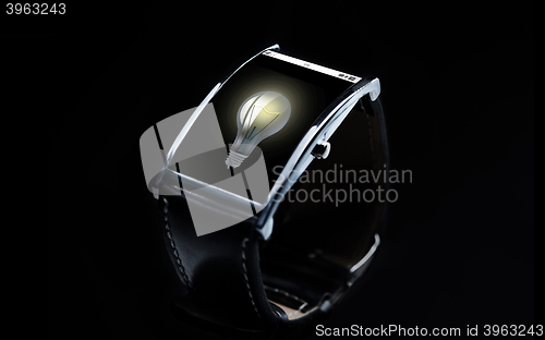 Image of close up of smart watch with light bulb icon