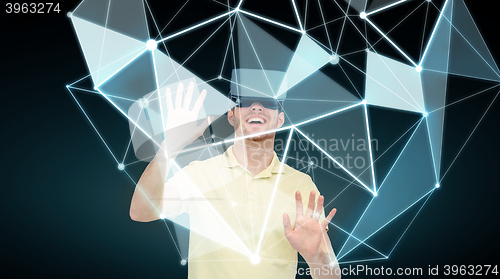 Image of happy man in virtual reality headset or 3d glasses