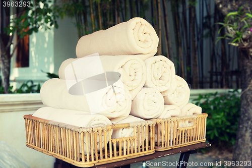 Image of rolled bath towels at hotel spa