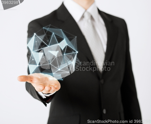 Image of man with virtual low poly projection on hand