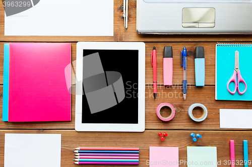 Image of close up of school supplies and tablet pc