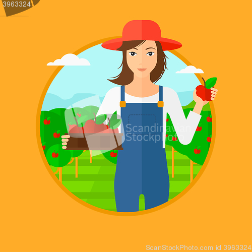 Image of Farmer collecting apples.