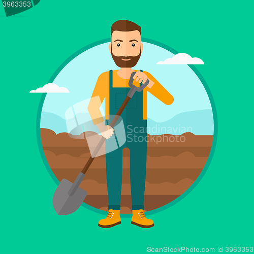 Image of Farmer on the field with shovel.