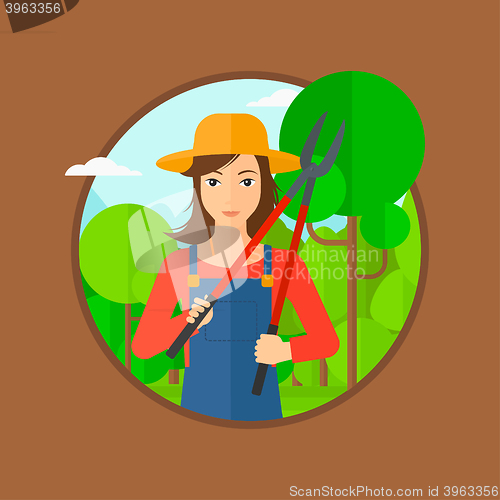 Image of Farmer with pruner in garden.