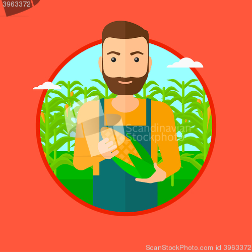 Image of Farmer holding corn.