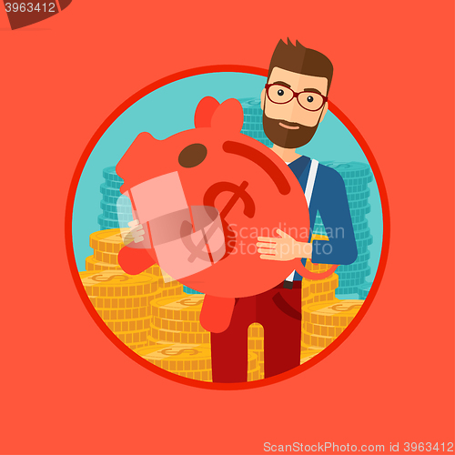 Image of Man carrying piggy bank.